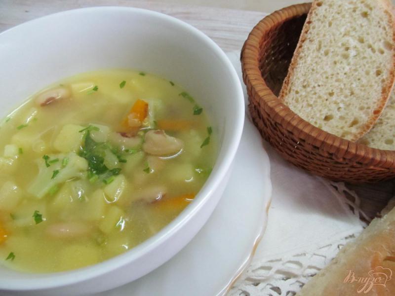 Фото приготовление рецепта: Суп с фасолью и цветной капустой шаг №8