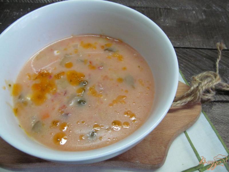 Фото приготовление рецепта: Суп с колбасками баклажаном рисом и каперсами шаг №10