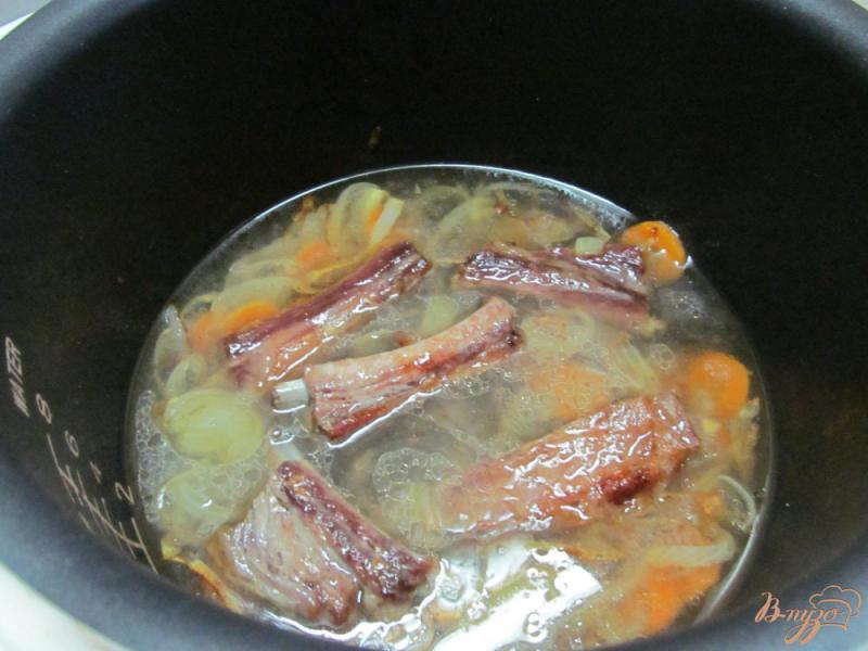 Фото приготовление рецепта: Свиные ребрышки с пшеном тыквой и брокколи шаг №4