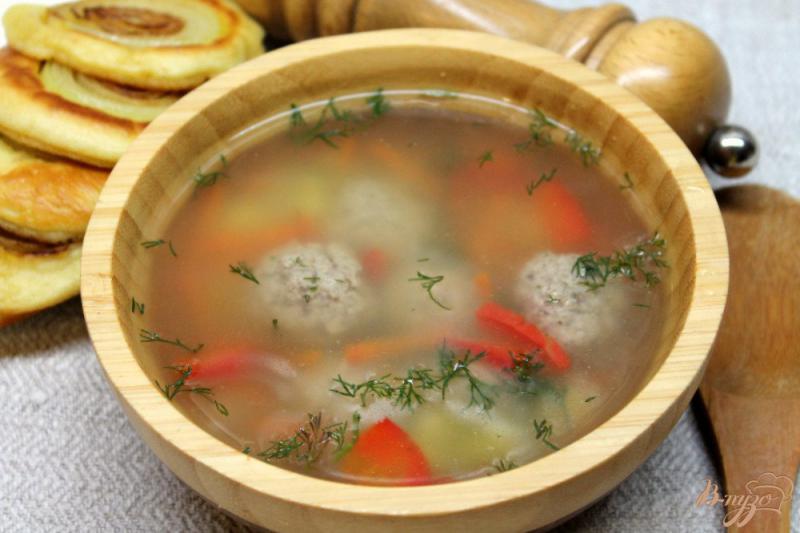 Фото приготовление рецепта: Суп с фрикадельками и рисом шаг №7