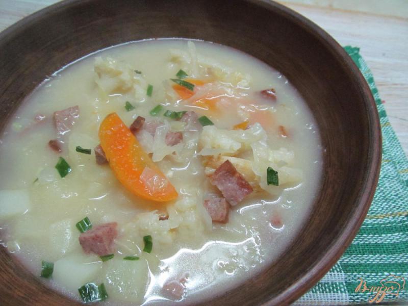 Фото приготовление рецепта: Суп с кислой капустой шаг №10