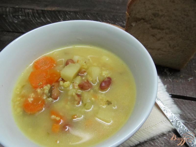 Фото приготовление рецепта: Суп с пшеном фасолью и замороженными овощами шаг №5