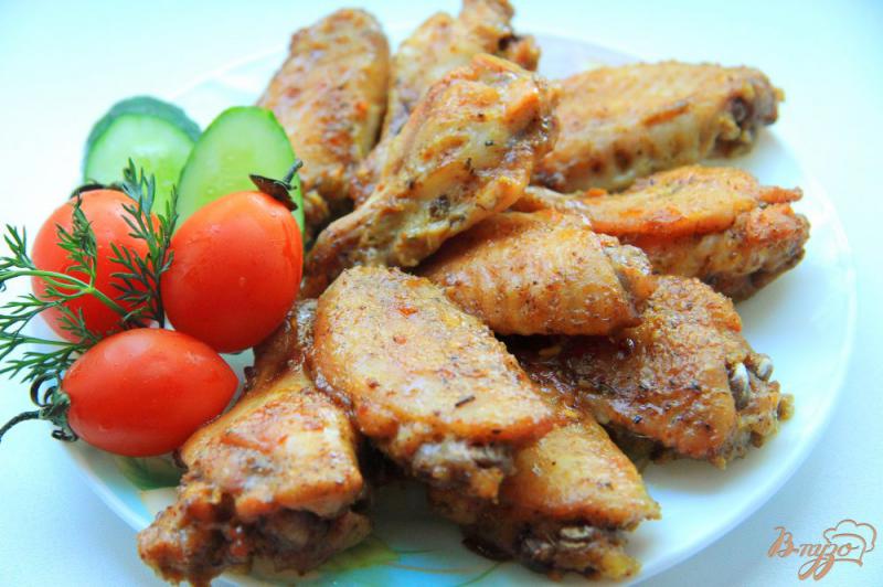 Фото приготовление рецепта: Куриные крылышки в маринаде с аджикой шаг №6