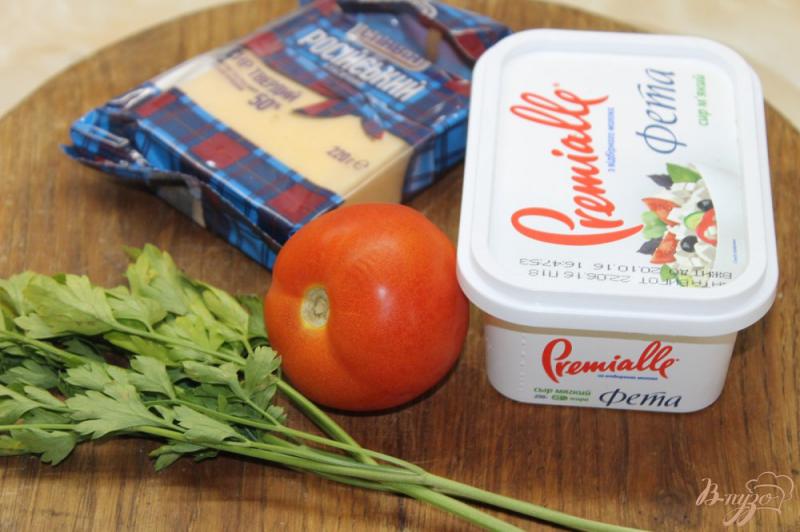 Фото приготовление рецепта: Жаренные кабачки из помидорами и сыром Фета в соусе шаг №5