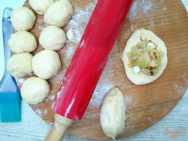 Фото приготовление рецепта: Пирожки с капустой в духовке шаг №11