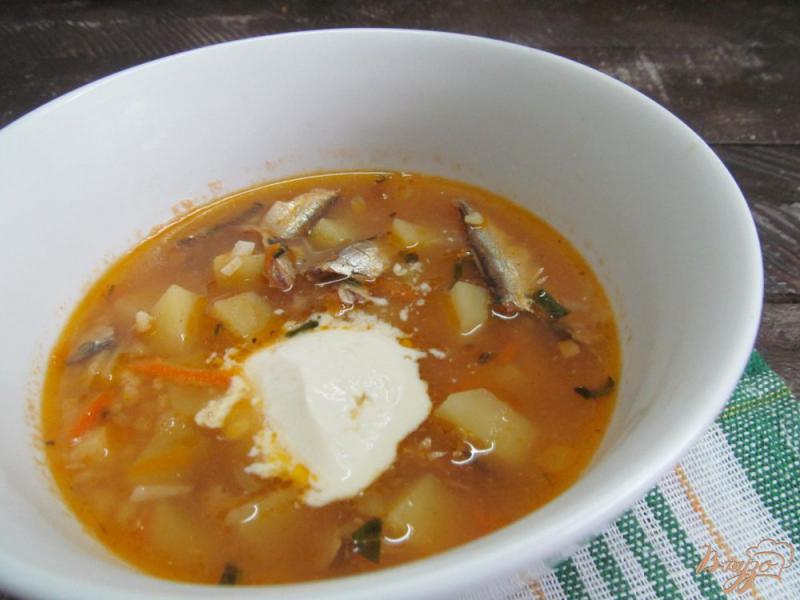 Фото приготовление рецепта: Суп с килькой в томате рисом и пшеном шаг №7