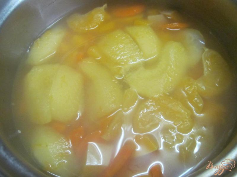 Фото приготовление рецепта: Рисовая каша с тыквой и мандарином шаг №2