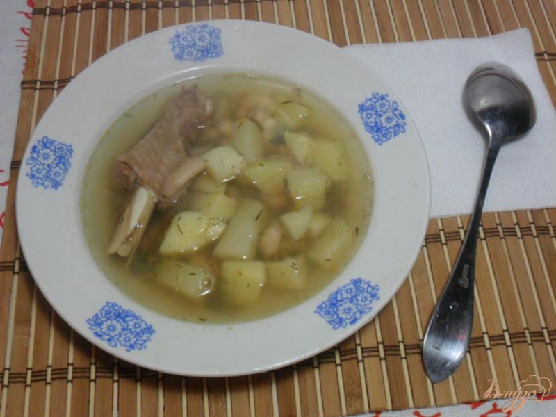 Фото приготовление рецепта: Куриный суп с фасолью шаг №5