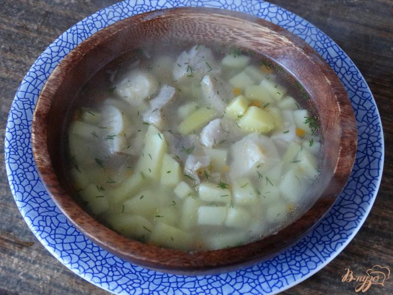 Фото приготовление рецепта: Рыбный суп с пангасиусом и кускусом шаг №6
