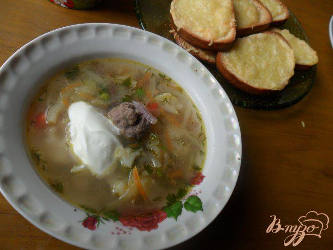 Фото приготовление рецепта: Весенний суп с фрикадельками шаг №7
