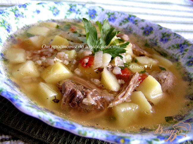 Фото приготовление рецепта: Суп из свинины с зеленой гречкой и томатами шаг №12