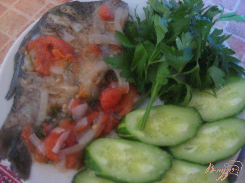 Фото приготовление рецепта: Рыба в помидорах шаг №10