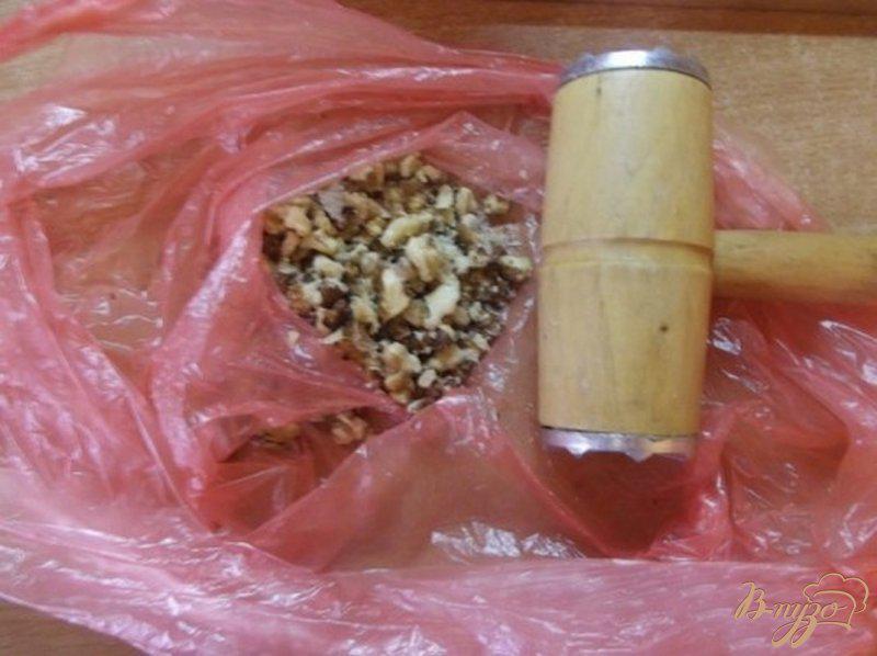 Фото приготовление рецепта: Тыква запеченная с сухофруктами и орехами шаг №4
