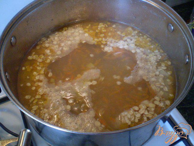Фото приготовление рецепта: Овсяный суп на курином бульоне шаг №4