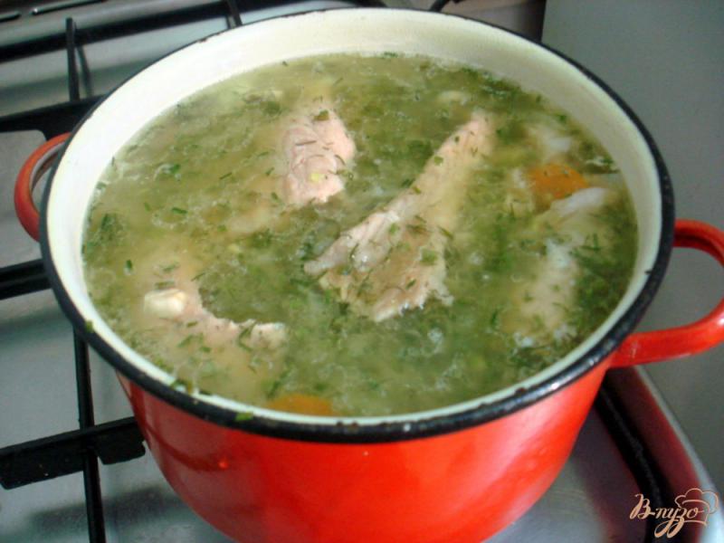Фото приготовление рецепта: Рыбный суп с томатами шаг №6