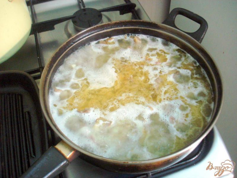 Фото приготовление рецепта: Куриные желудочки в томатно - сметанном соусе шаг №4