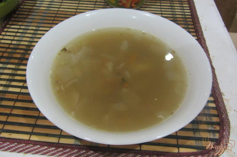 Фото приготовление рецепта: Рыбный суп с манной крупой шаг №8