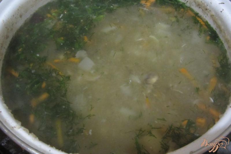 Фото приготовление рецепта: Рыбный суп с манной крупой шаг №7