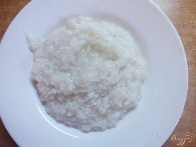 Фото приготовление рецепта: Рис с клюквой и льняным маслом шаг №2