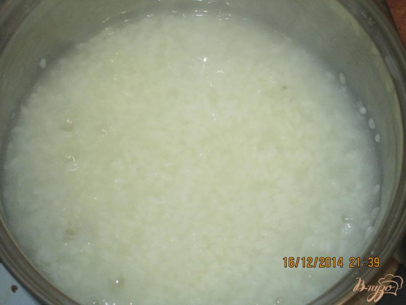 Фото приготовление рецепта: Рисовая  молочная  каша шаг №2