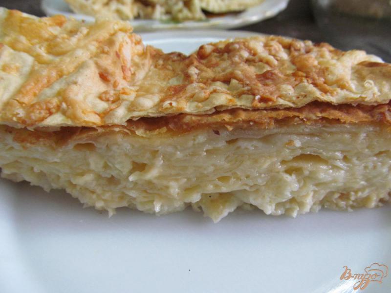 Фото приготовление рецепта: Слоеный сырный пирог в лаваше шаг №7