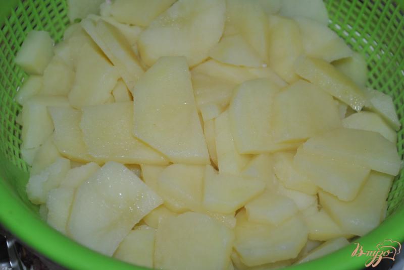 Фото приготовление рецепта: Кальмары с картофелем в сметанном соусе шаг №7