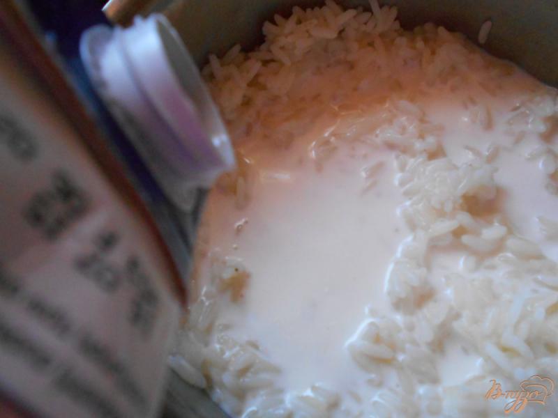 Фото приготовление рецепта: Рисовый пудинг с корицей и апельсином шаг №2