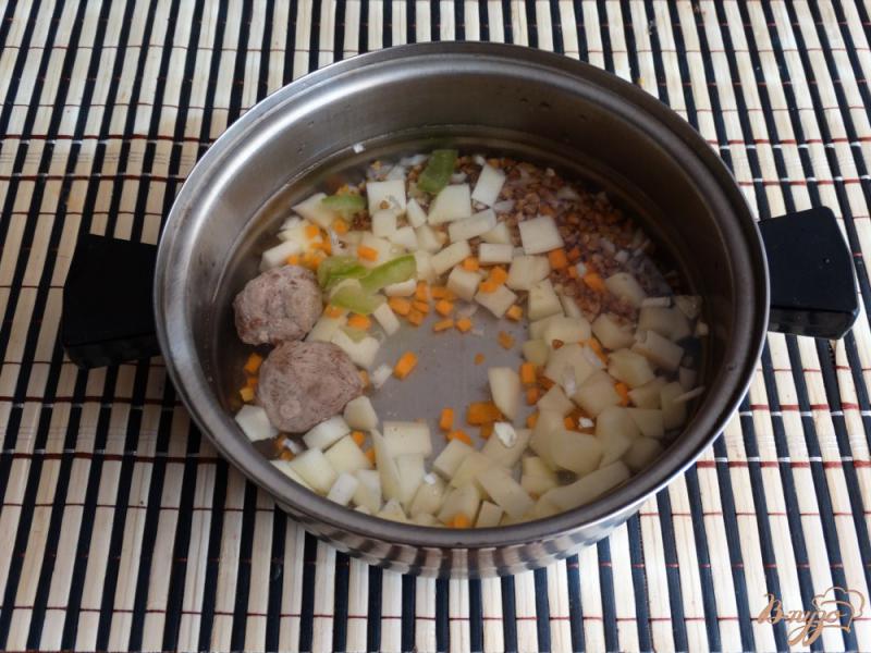 Фото приготовление рецепта: Гречневый суп с молодой капустой шаг №8