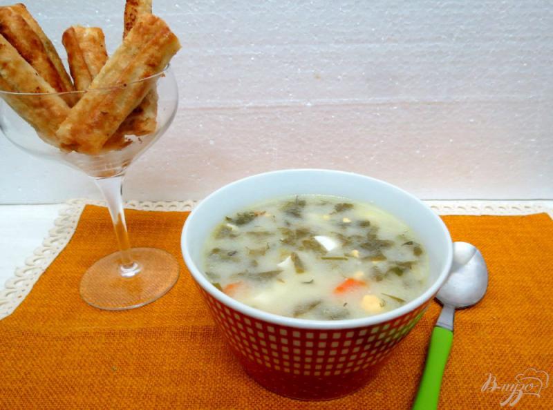 Фото приготовление рецепта: Щавелевый суп с плавленым сыром шаг №9