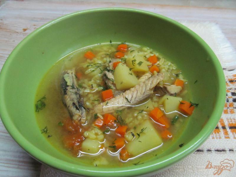 Фото приготовление рецепта: Суп с рыбными консервами шаг №7