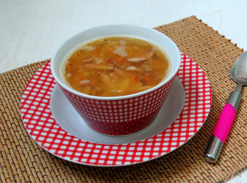 Фото приготовление рецепта: Гороховый суп с копчёными сосисками шаг №7