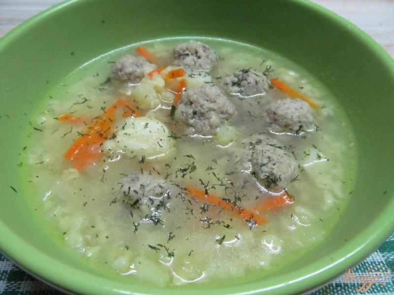 Фото приготовление рецепта: Суп с фрикадельками и булгуром шаг №7
