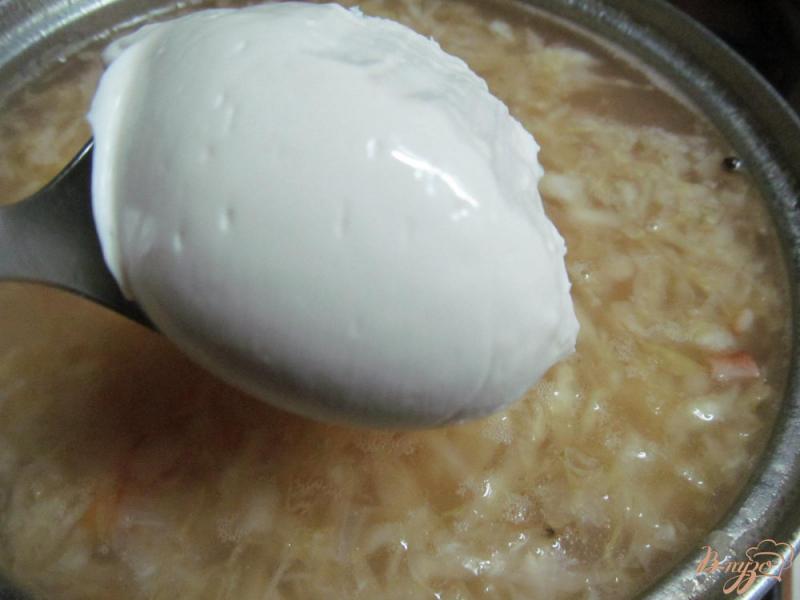 Фото приготовление рецепта: Суп с кислой капустой шаг №9