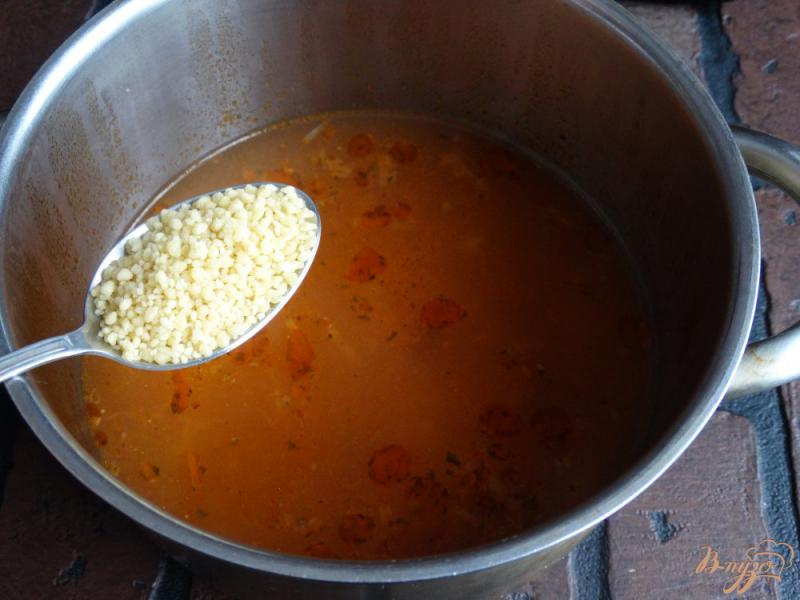 Фото приготовление рецепта: Суп с квашеной капустой, опятами и кус-кусом шаг №6