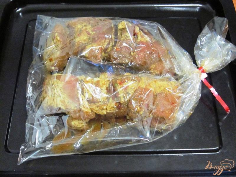 Фото приготовление рецепта: Свиные ребрышки в пикантном маринаде шаг №6