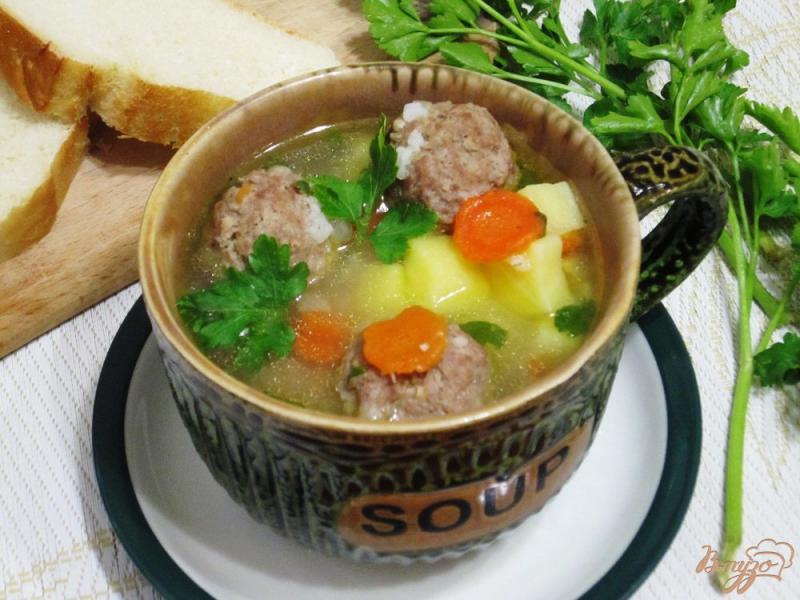 Фото приготовление рецепта: Суп с овощами и фрикадельками шаг №13