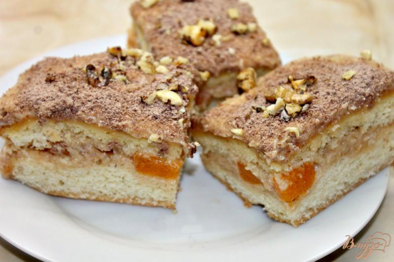 Фото приготовление рецепта: Бисквитный торт с масляным кремом и мандаринами шаг №11