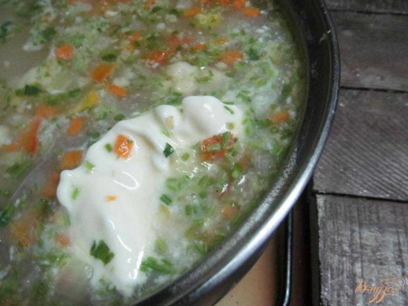 Фото приготовление рецепта: Суп с пшеном фасолью и замороженными овощами шаг №4