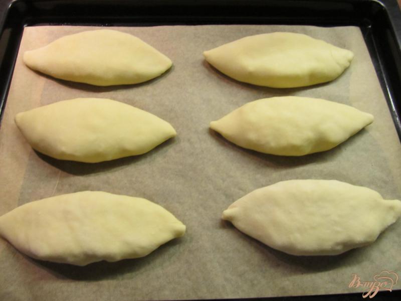 Фото приготовление рецепта: Пирожки с рисом в духовке шаг №14
