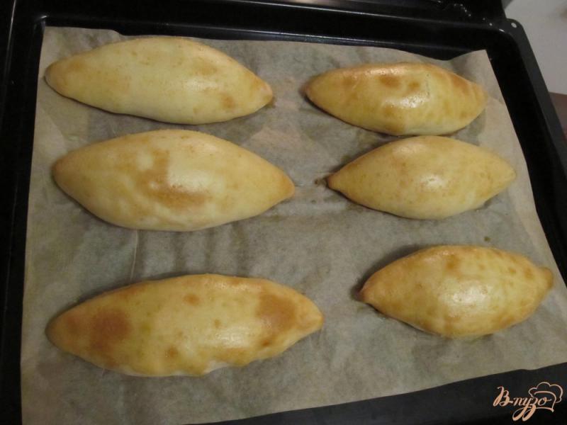 Фото приготовление рецепта: Пирожки с рисом в духовке шаг №16