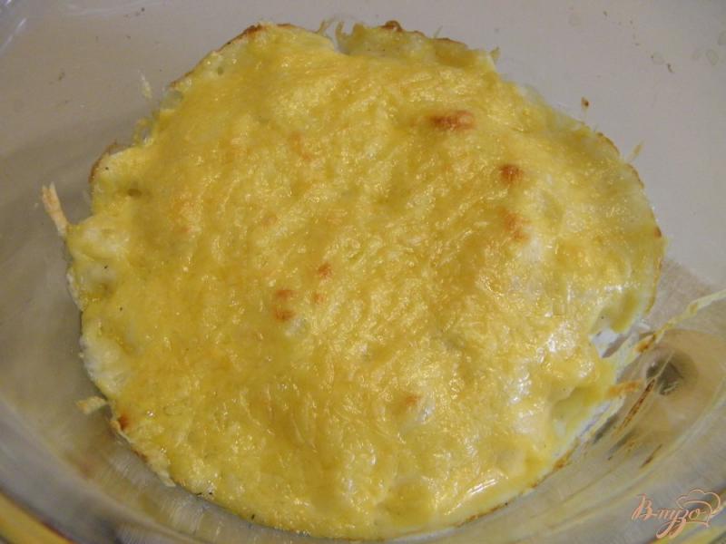 Фото приготовление рецепта: Цветная капуста запеченная под сырным соусом шаг №10