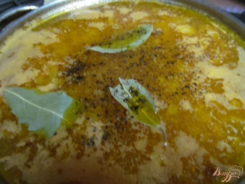 Фото приготовление рецепта: Суп с килькой в томате рисом и пшеном шаг №5