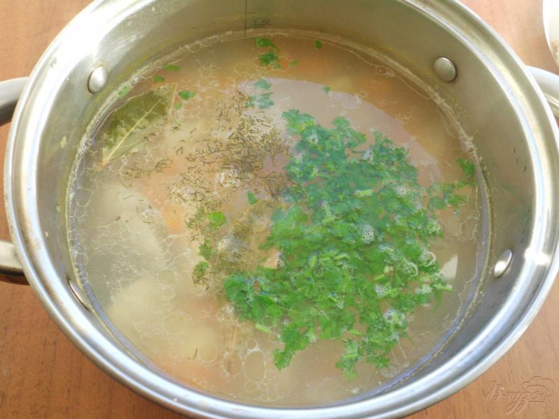 Фото приготовление рецепта: Суп из молочного хека с рисом шаг №6