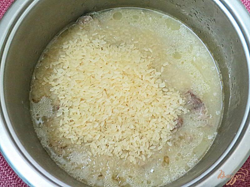 Фото приготовление рецепта: Рис с куриными желудочками шаг №6
