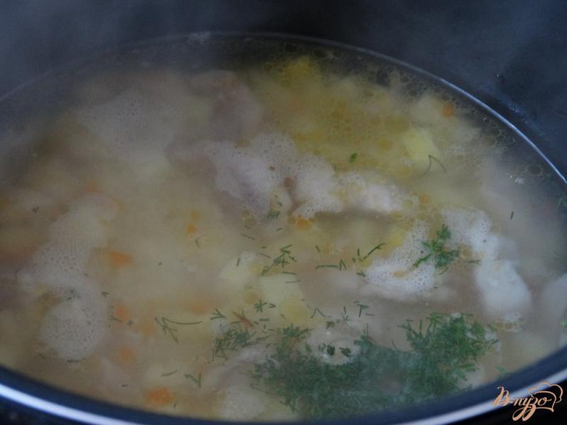 Фото приготовление рецепта: Рыбный суп с пангасиусом и кускусом шаг №5
