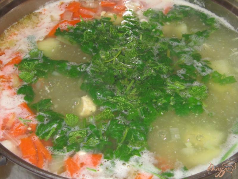 Фото приготовление рецепта: Суп из куриной грудки с кукурузной крупой шаг №11