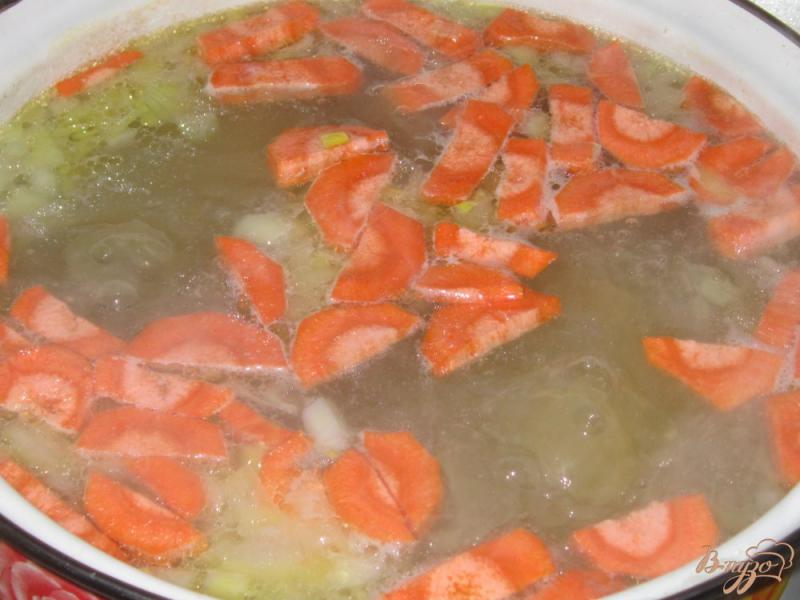 Фото приготовление рецепта: Куриный суп с яйцом и пшеном шаг №9