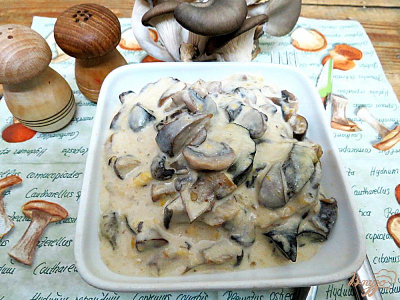 Фото приготовление рецепта: Грибы в сметанном соусе с сыром шаг №10
