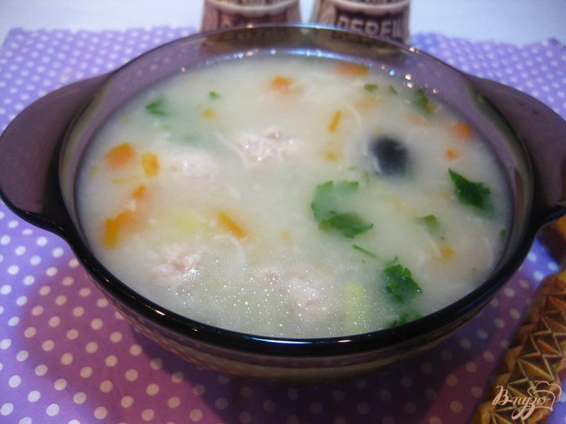 Фото приготовление рецепта: Суп с фрикадельками и маслинами шаг №10