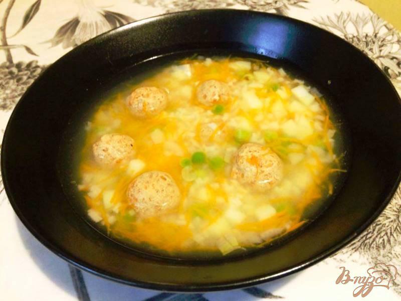 Фото приготовление рецепта: Суп с фрикадельками  и рисом для деток шаг №8